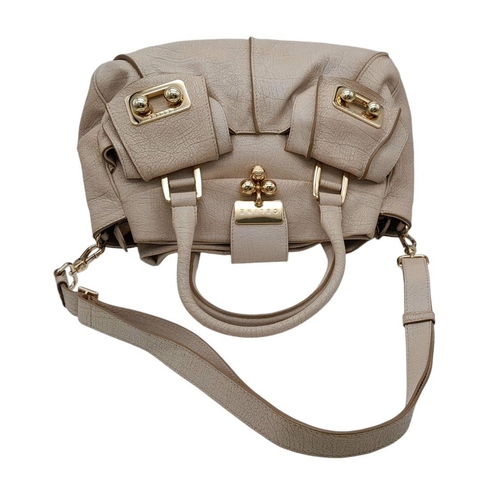 234 - A Celine Brown Leather Shoulder Bag. Gold tone hardware. Twin exterior pockets. Two large clip open ... 