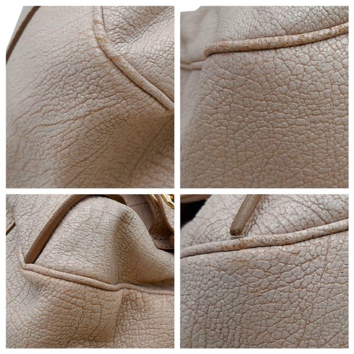 234 - A Celine Brown Leather Shoulder Bag. Gold tone hardware. Twin exterior pockets. Two large clip open ... 