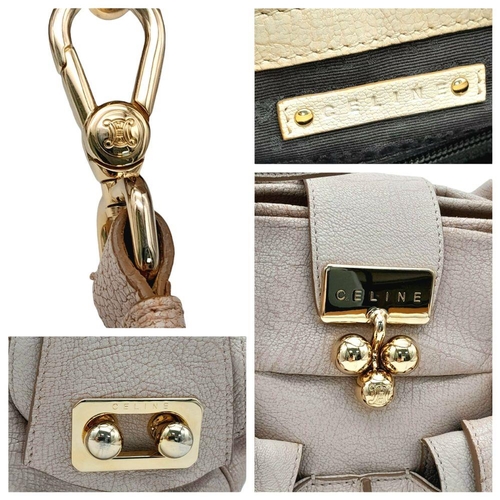 234 - A Celine Brown Leather Shoulder Bag. Gold tone hardware. Twin exterior pockets. Two large clip open ... 