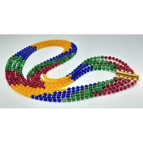 238 - A five multi gem strand necklace with gold plated parts. Length: 57-71 cm, weight: 84 g.