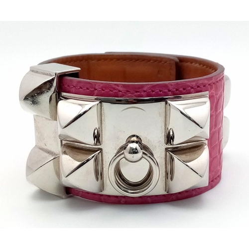 250 - A Hermes Collier de Chien Leather Bangle/Bracelet. Magenta leather with spike-stud detail. Adjustabl... 