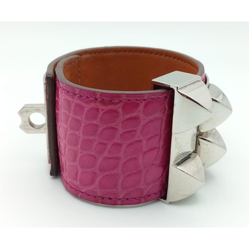 250 - A Hermes Collier de Chien Leather Bangle/Bracelet. Magenta leather with spike-stud detail. Adjustabl... 