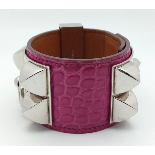 250 - A Hermes Collier de Chien Leather Bangle/Bracelet. Magenta leather with spike-stud detail. Adjustabl... 