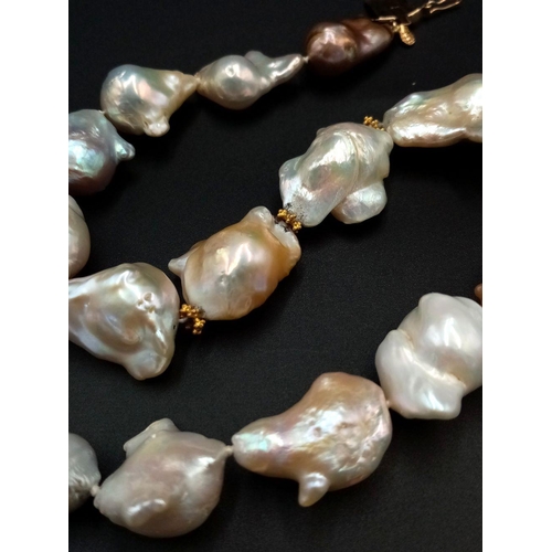 260 - A Mesmerising Vintage Baroque Pearl Necklace with a Stylish 14K Gold Clasp. Pastel shades of abstrac... 