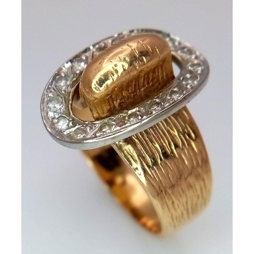 345 - A 9K Yellow Gold and Diamond Belt Buckle Ring. Oval diamond surround. Size O. 7.25g total weight.