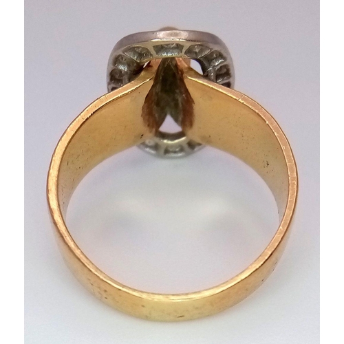 345 - A 9K Yellow Gold and Diamond Belt Buckle Ring. Oval diamond surround. Size O. 7.25g total weight.