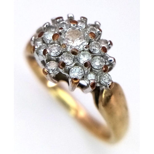 365 - A 9K Yellow Gold Diamond Cluster Ring. 0.50ctw of diamonds in floral form. Size L. 2.95g total weigh... 