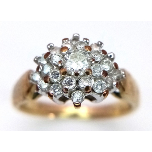 365 - A 9K Yellow Gold Diamond Cluster Ring. 0.50ctw of diamonds in floral form. Size L. 2.95g total weigh... 