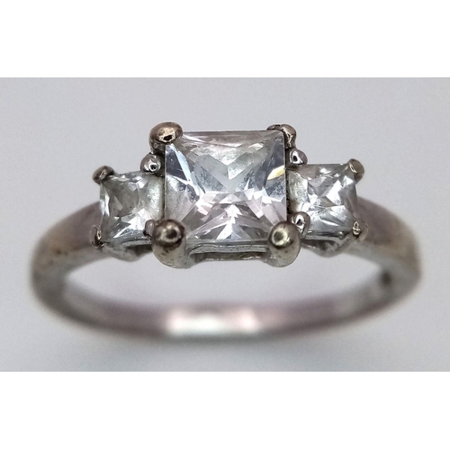 372 - A 9K Gold Three Stone White Zircon Ring. Size M. 2.5g total weight.