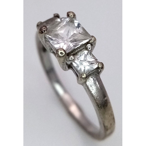 372 - A 9K Gold Three Stone White Zircon Ring. Size M. 2.5g total weight.