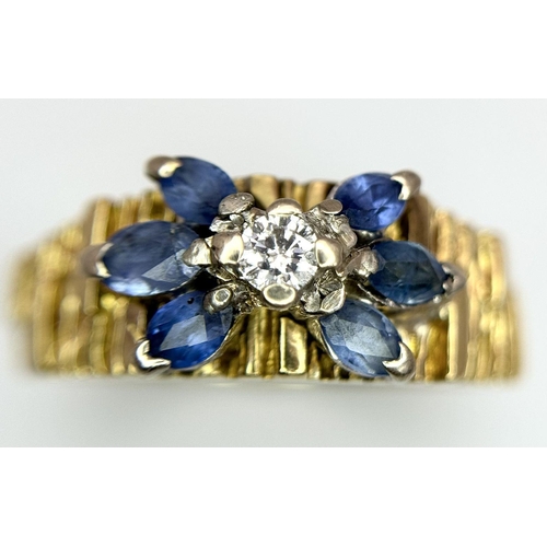 45 - An 18K Sapphire and Diamond 18k Gold Ring. Central diamond with a four petal sapphire surround. Size... 