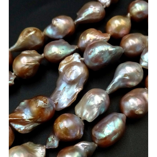 46 - A Vintage Matinee Length Baroque Pearl Necklace with a 14K Gold (tested) Clasp. Fantastic quality pe... 