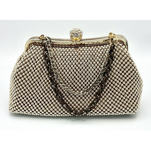 476 - A Vivienne Westwood Vintage Handbag. Geometric ball decoration with a stone set handle. 22cm x 13cm.... 