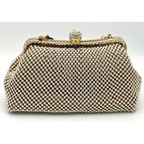 476 - A Vivienne Westwood Vintage Handbag. Geometric ball decoration with a stone set handle. 22cm x 13cm.... 