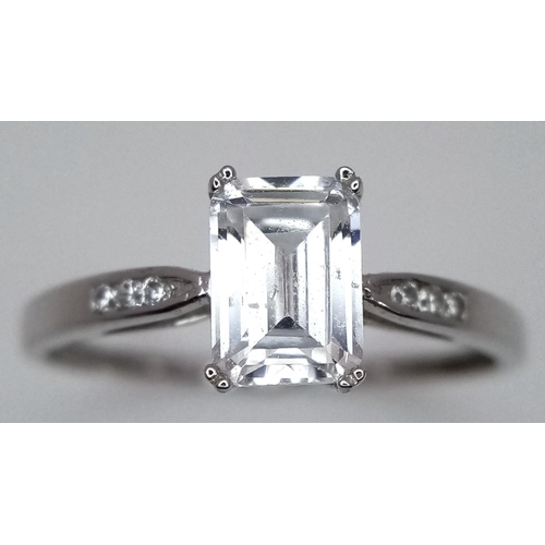 484 - A 9K White Gold CZ Ring. Size R. 1.8g total weight.