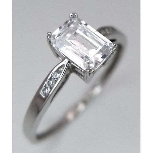 484 - A 9K White Gold CZ Ring. Size R. 1.8g total weight.