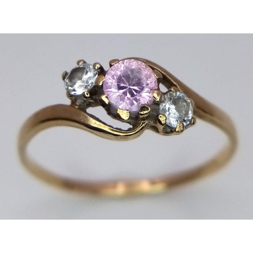 490 - A 9K Yellow Gold Pink and White Stone Crossover Ring. Size P. 1.3g total weight.