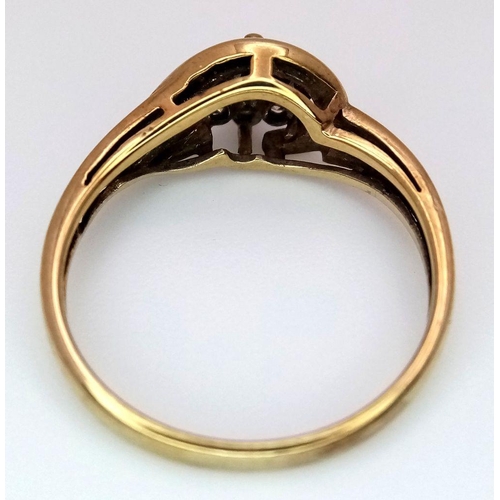 491 - A 9K Yellow Gold Diamond Crossover Ring. Size M. 2.05g total weight.