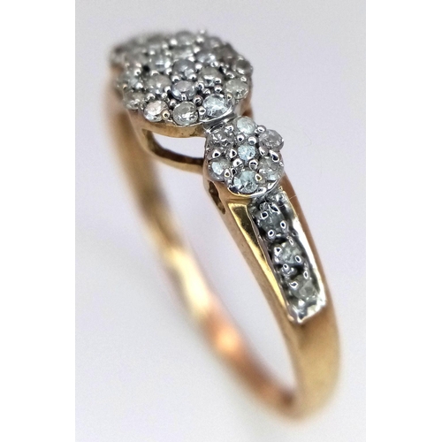 498 - A 9k Yellow Gold Diamond Cluster Ring. Size P. 2.10g total weight.