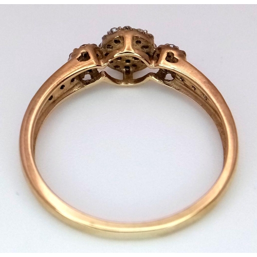 498 - A 9k Yellow Gold Diamond Cluster Ring. Size P. 2.10g total weight.