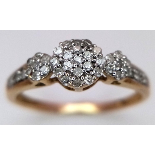 498 - A 9k Yellow Gold Diamond Cluster Ring. Size P. 2.10g total weight.