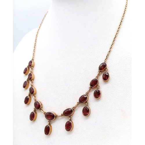 510 - An Antique Beautiful 9K Yellow Gold Garnet Necklace. 40cm length. 9g total weight.