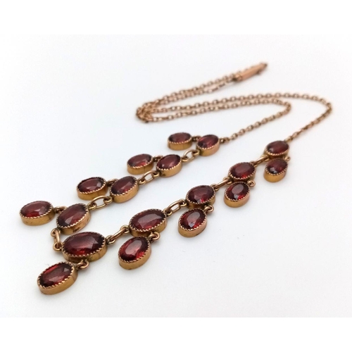 510 - An Antique Beautiful 9K Yellow Gold Garnet Necklace. 40cm length. 9g total weight.