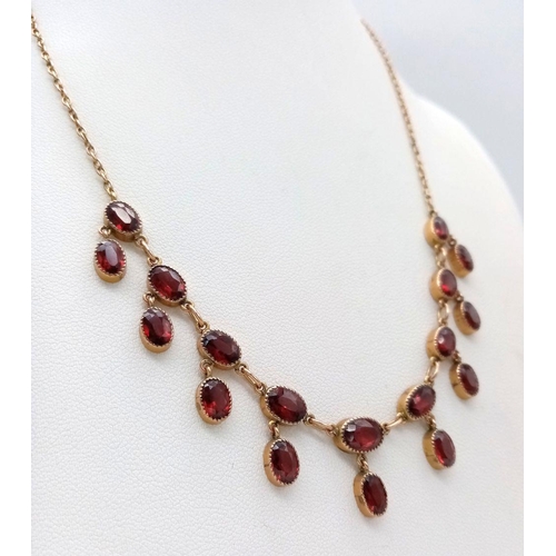 510 - An Antique Beautiful 9K Yellow Gold Garnet Necklace. 40cm length. 9g total weight.