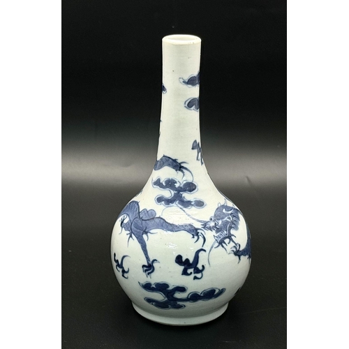 715 - An 18th Century Small Blue and White Ceramic Vase. Dragon decoration. 16cm tall.