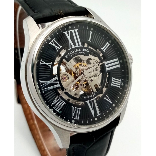 939 - A Sturhling Automatic Skeleton Gents Watch. Black leather strap. Stainless steel case - 42mm. Black ... 