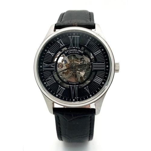 939 - A Sturhling Automatic Skeleton Gents Watch. Black leather strap. Stainless steel case - 42mm. Black ... 