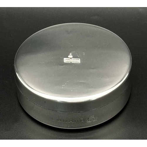 940 - A Cunard Aquascutum White Metal Trinket Box. 8cm diameter. Comes with original pouch and box. Given ... 