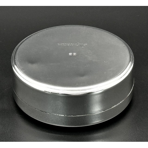 940 - A Cunard Aquascutum White Metal Trinket Box. 8cm diameter. Comes with original pouch and box. Given ... 