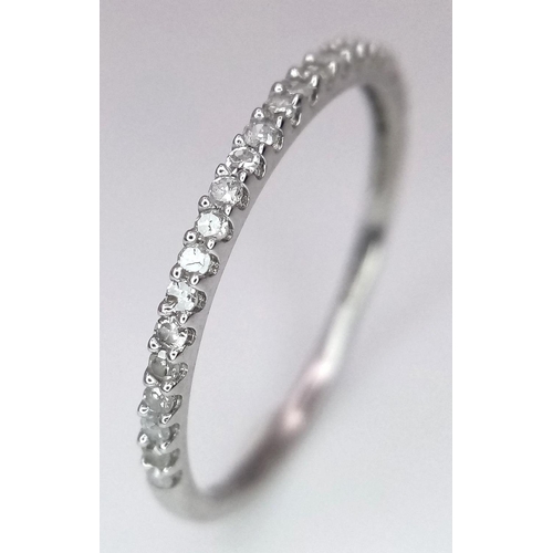 1341 - A 9K WHITE GOLD DIAMOND BAND RING. 0.15CT. 0.7G. SIZE M. A/S SC7.