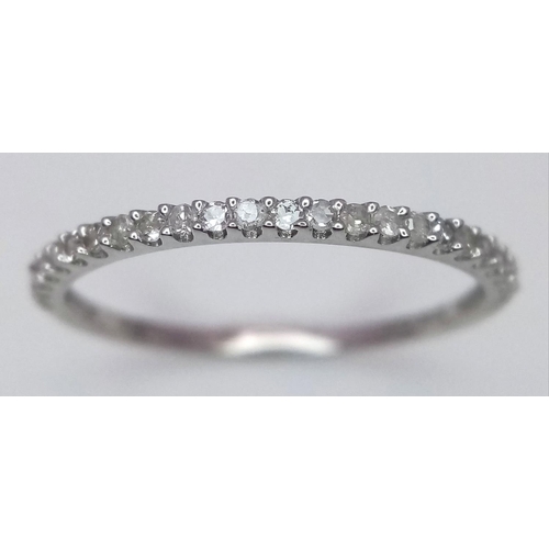 1341 - A 9K WHITE GOLD DIAMOND BAND RING. 0.15CT. 0.7G. SIZE M. A/S SC7.