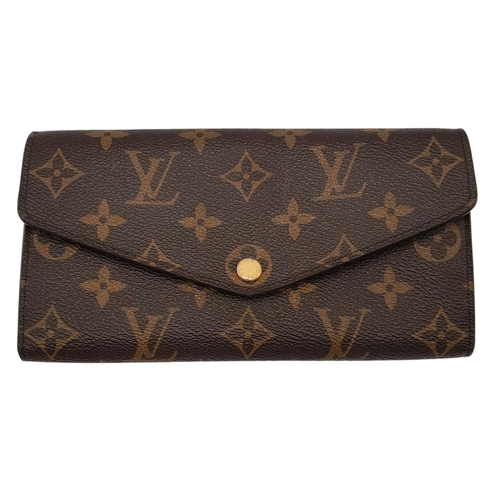 877 - Louis Vuitton Sarah Wallet Monogram Canvas. Monogram coated canvas exterior with gold-tone hardware ... 