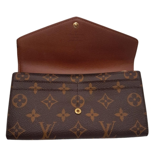 877 - Louis Vuitton Sarah Wallet Monogram Canvas. Monogram coated canvas exterior with gold-tone hardware ... 