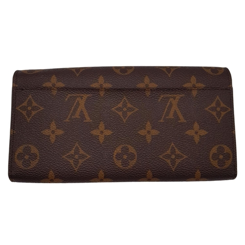 877 - Louis Vuitton Sarah Wallet Monogram Canvas. Monogram coated canvas exterior with gold-tone hardware ... 