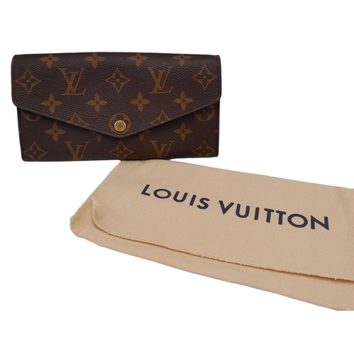 877 - Louis Vuitton Sarah Wallet Monogram Canvas. Monogram coated canvas exterior with gold-tone hardware ... 