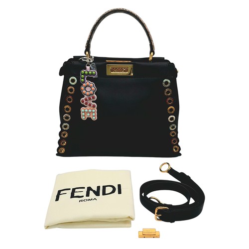 4 - A Fendi Peekaboo Bag. Black leather exterior with multi-colour eyelets and 'Love' fob. Gold tone har... 