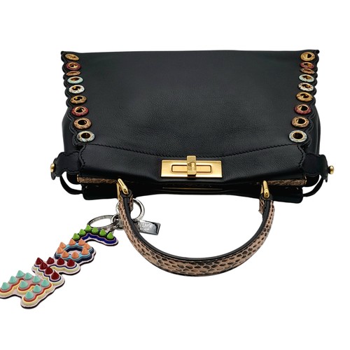 4 - A Fendi Peekaboo Bag. Black leather exterior with multi-colour eyelets and 'Love' fob. Gold tone har... 