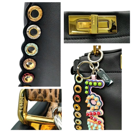 4 - A Fendi Peekaboo Bag. Black leather exterior with multi-colour eyelets and 'Love' fob. Gold tone har... 