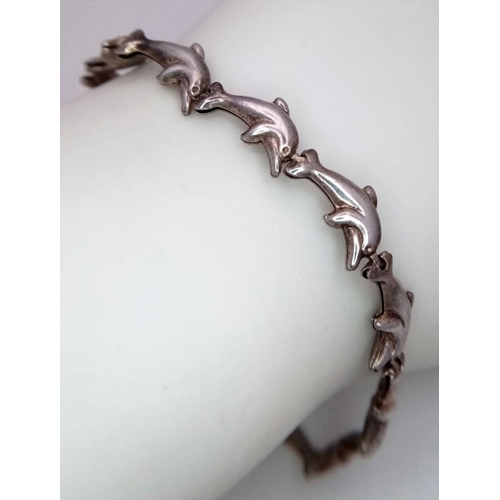 1349 - A STERLING SILVER DOLPHIN LINKS BRACELET - 5.9G. SC3079.