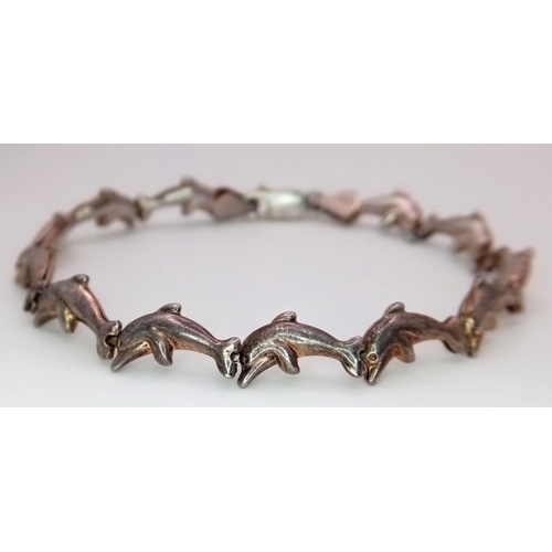 1349 - A STERLING SILVER DOLPHIN LINKS BRACELET - 5.9G. SC3079.