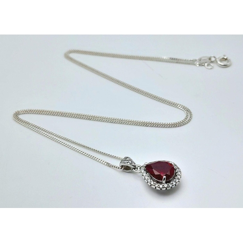 913 - A Sterling Silver Ruby and Clear Stone Pendant Necklace. 51cm Sterling Silver Chain. Sterling Silver... 