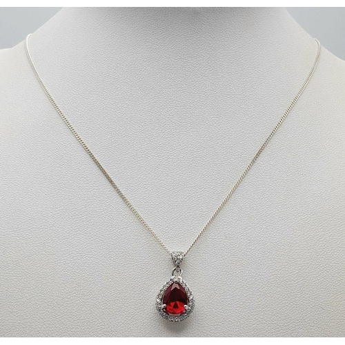 913 - A Sterling Silver Ruby and Clear Stone Pendant Necklace. 51cm Sterling Silver Chain. Sterling Silver... 