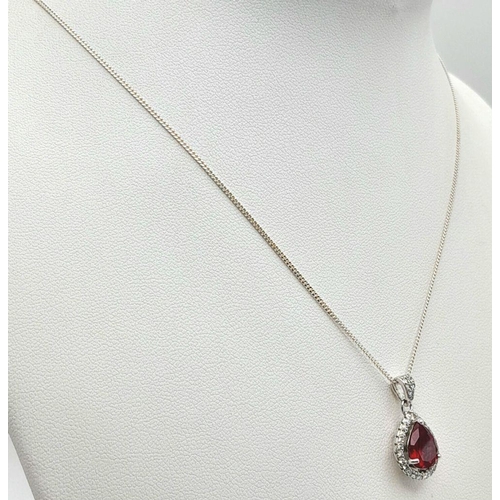 913 - A Sterling Silver Ruby and Clear Stone Pendant Necklace. 51cm Sterling Silver Chain. Sterling Silver... 