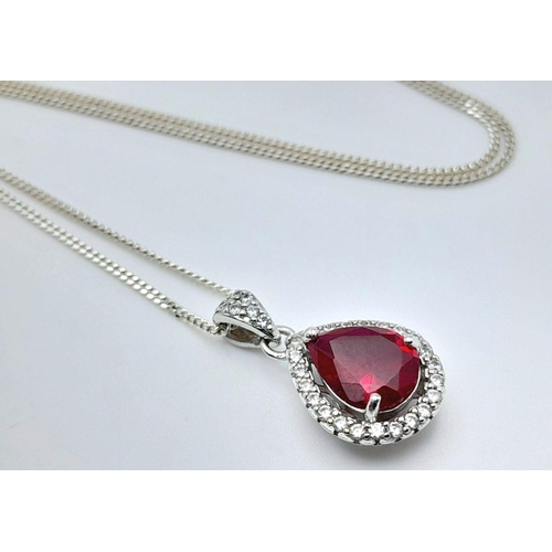 913 - A Sterling Silver Ruby and Clear Stone Pendant Necklace. 51cm Sterling Silver Chain. Sterling Silver... 