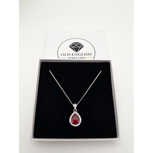 913 - A Sterling Silver Ruby and Clear Stone Pendant Necklace. 51cm Sterling Silver Chain. Sterling Silver... 