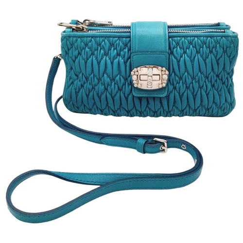 730 - A Miu Miu Turquoise Crystal Bag. Matelasse leather exterior with silver-toned hardware, detachable a... 